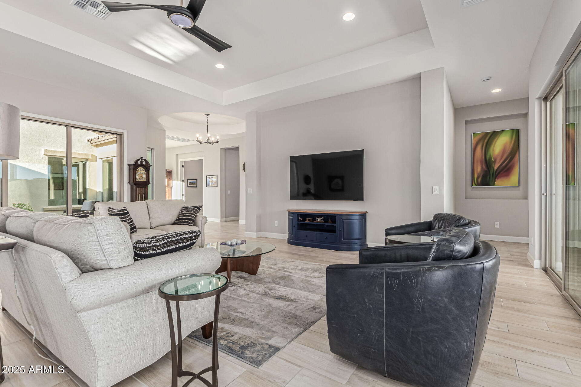 20709 West Rattler Road Buckeye, AZ 85396 - Photo 10 of 66 a living room with furniture and a flat screen tv