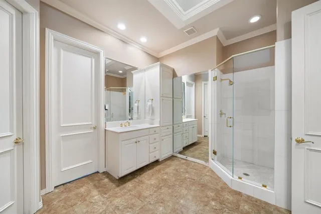 a bed room with a bed and a chandelier