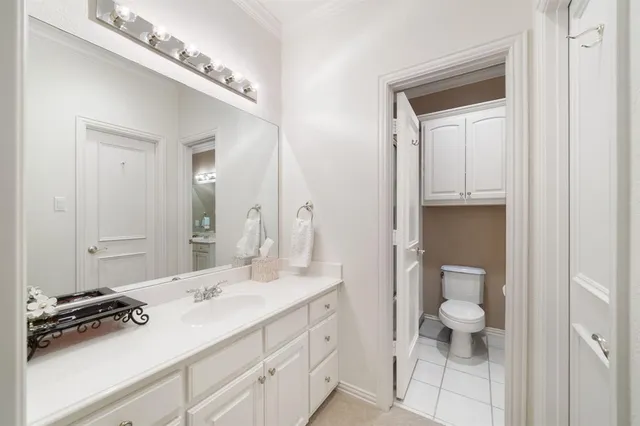 a bedroom with furniture and a chandelier