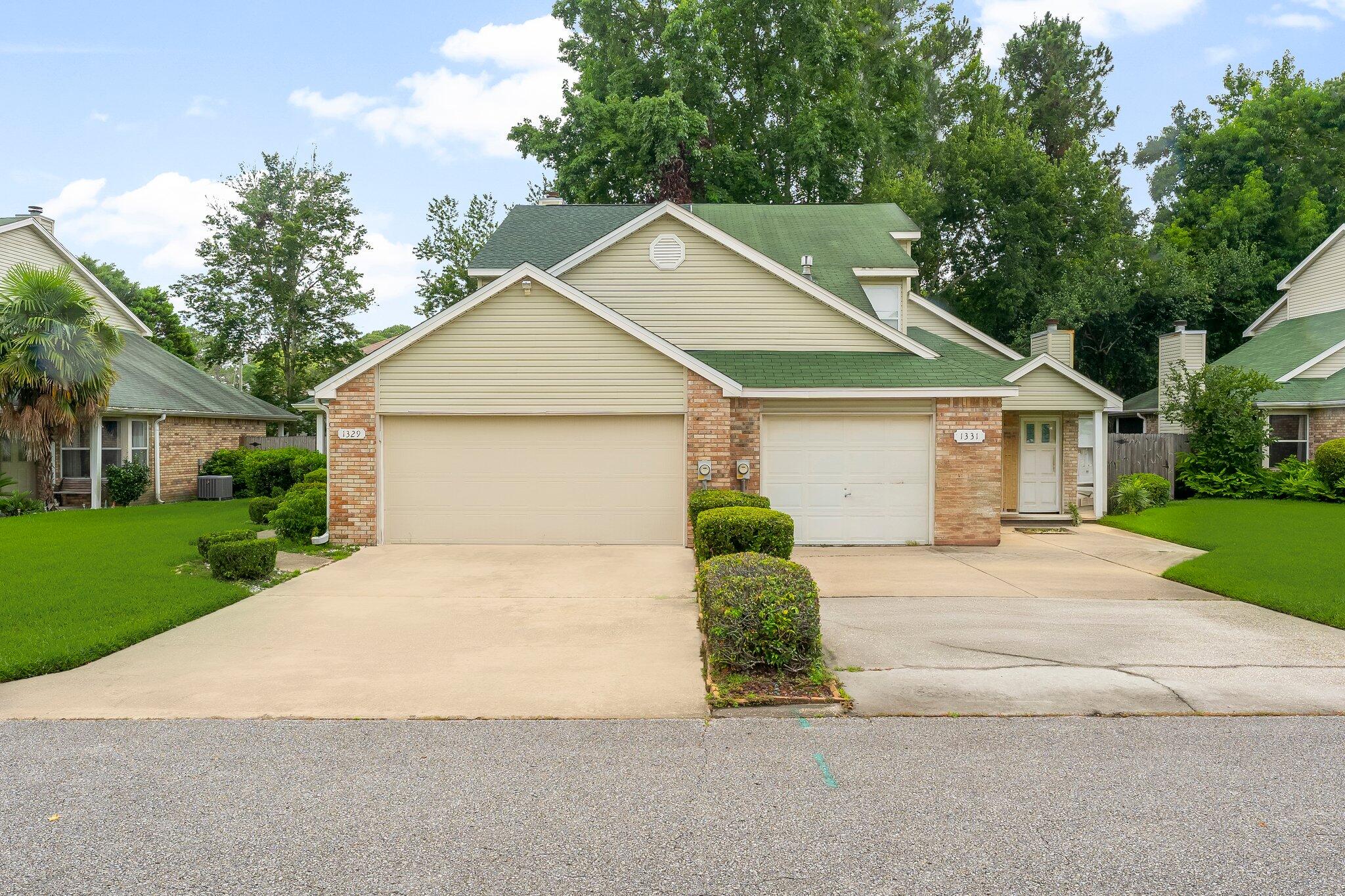 1329 White Blossom Lane Fort Walton Beach, FL 32547 - Photo 1 of 27 a front view of house with yard and trees