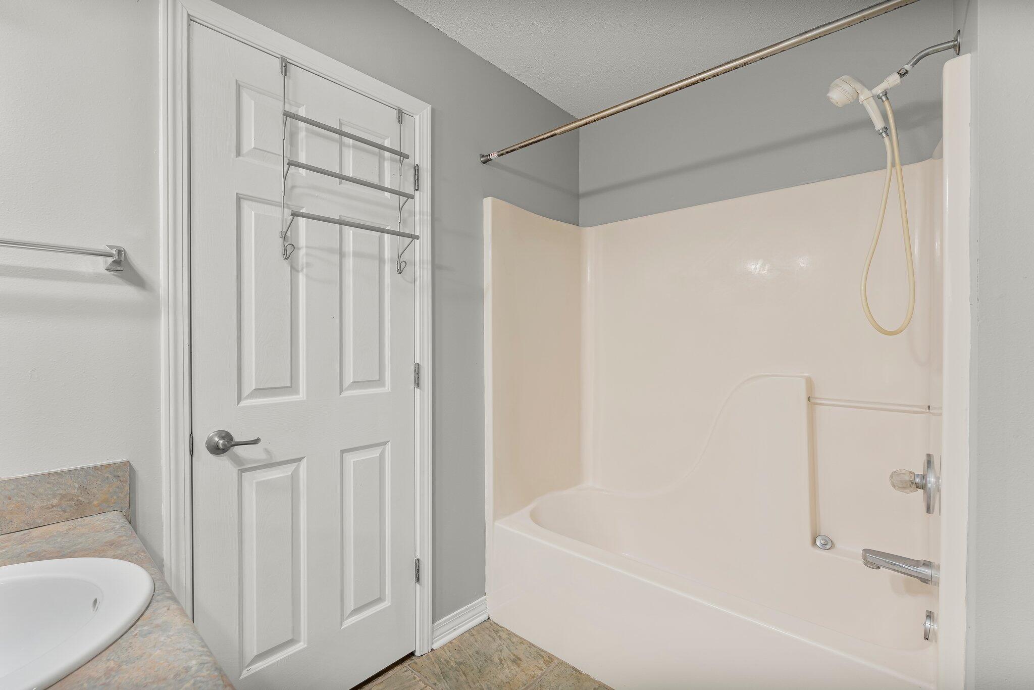 1329 White Blossom Lane Fort Walton Beach, FL 32547 - Photo 15 of 27 a bathroom with a bathtub and a shower
