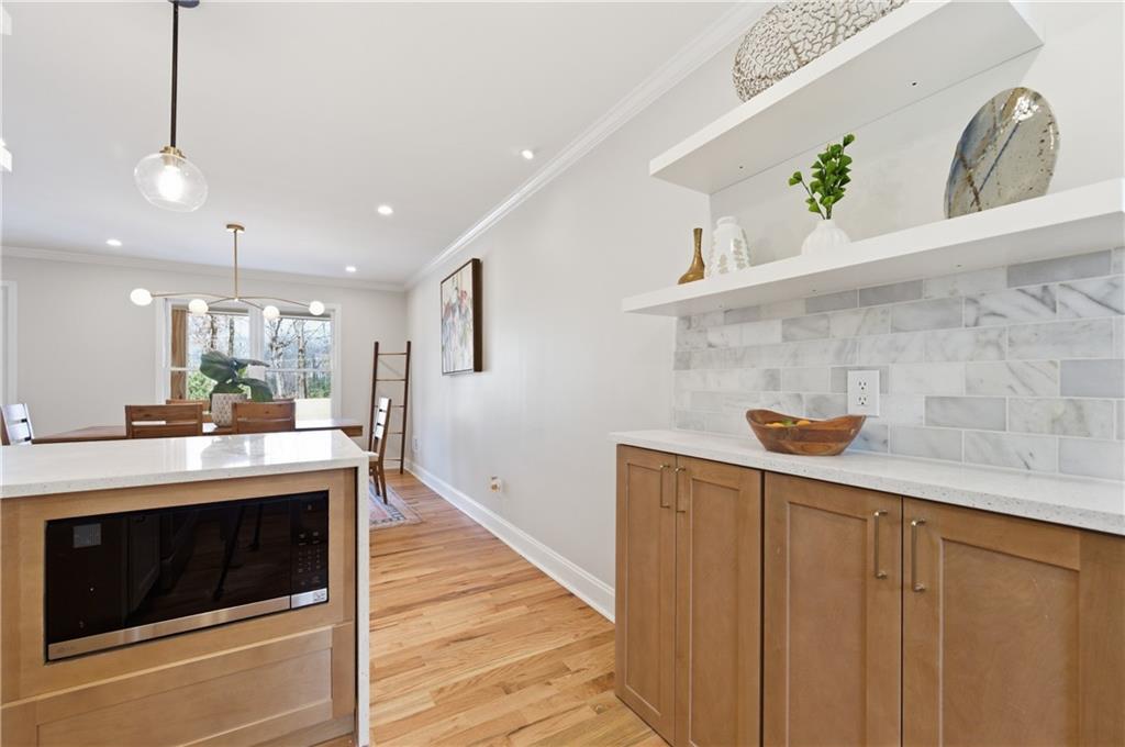 3571 Midvale Forest Court Tucker, GA 30084 - Photo 16 of 53 a kitchen with stainless steel appliances granite countertop a sink a stove and a wooden floors