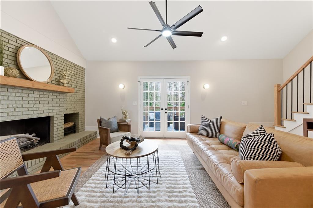 3571 Midvale Forest Court Tucker, GA 30084 - Photo 21 of 53 a living room with furniture a fireplace and a large window