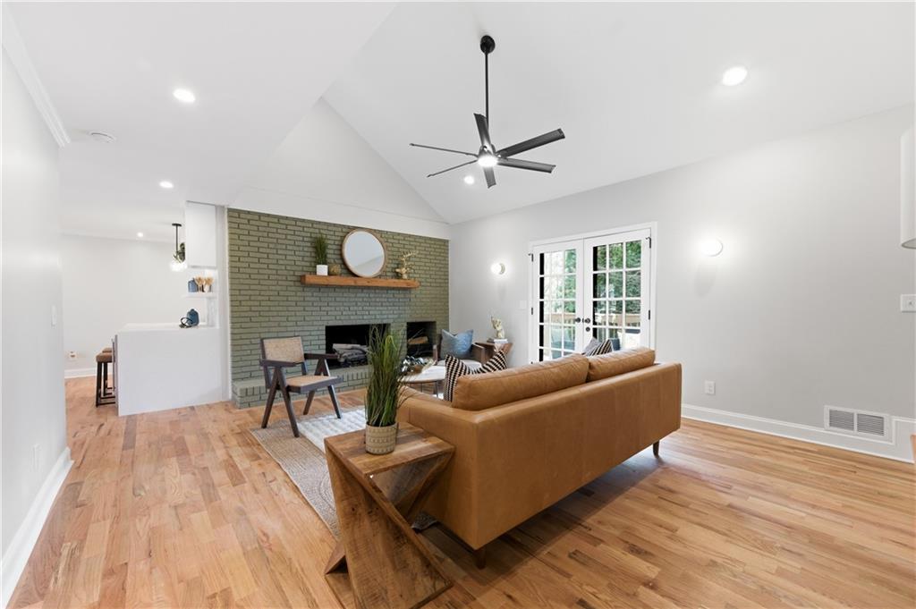 3571 Midvale Forest Court Tucker, GA 30084 - Photo 23 of 53 a living room with furniture a fireplace and a window