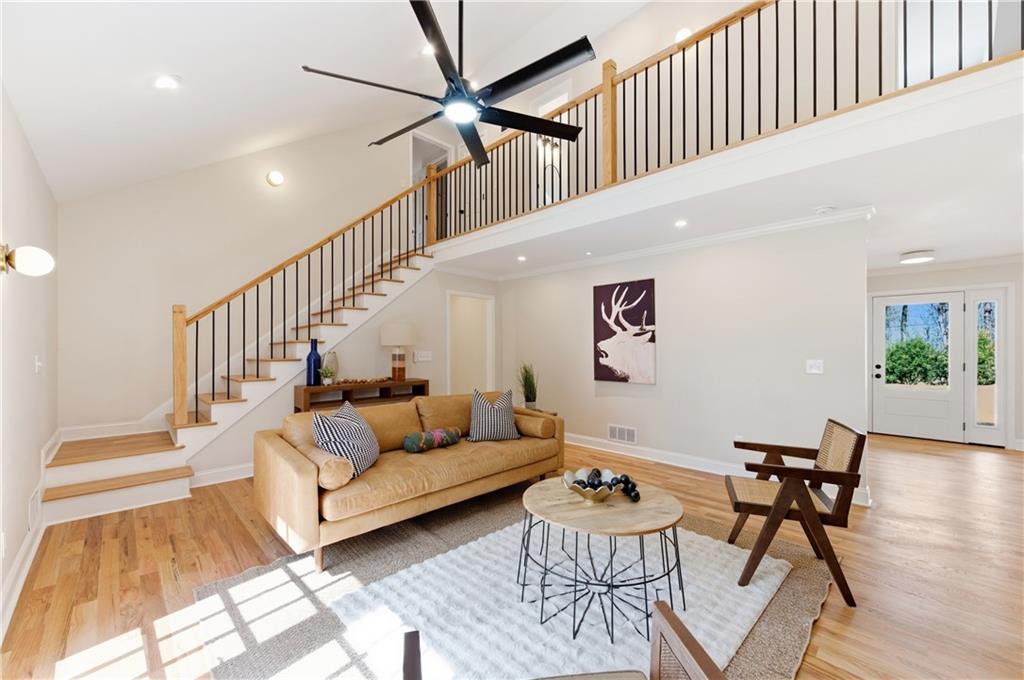 3571 Midvale Forest Court Tucker, GA 30084 - Photo 24 of 53 a living room with furniture and a dining table with wooden floor