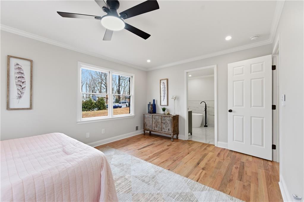 3571 Midvale Forest Court Tucker, GA 30084 - Photo 28 of 53 a spacious bedroom with a bed and a window