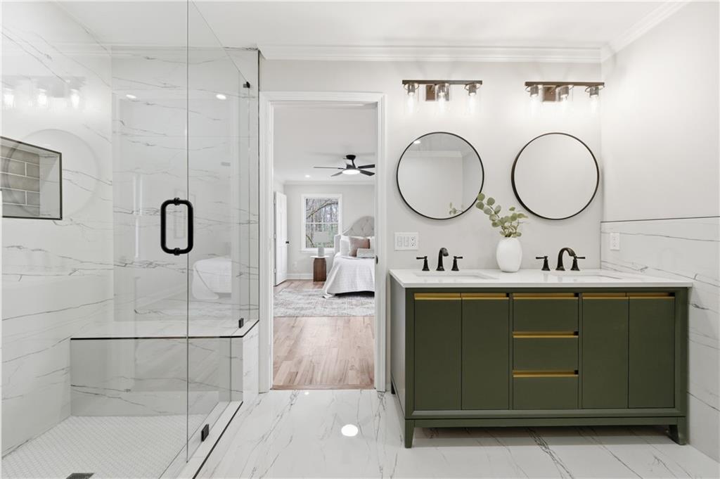 3571 Midvale Forest Court Tucker, GA 30084 - Photo 31 of 53 a bathroom with a granite countertop sink mirror and a shower