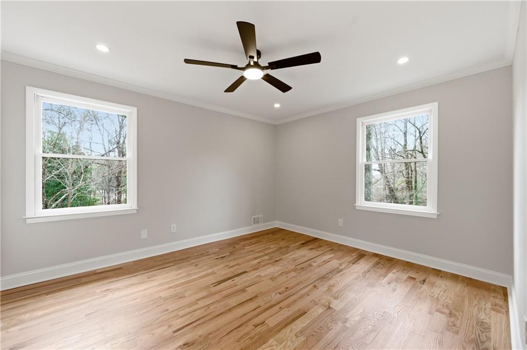 3571 Midvale Forest Court Tucker, GA 30084 - Photo 32 of 53 a view of an empty room with wooden floor and a window