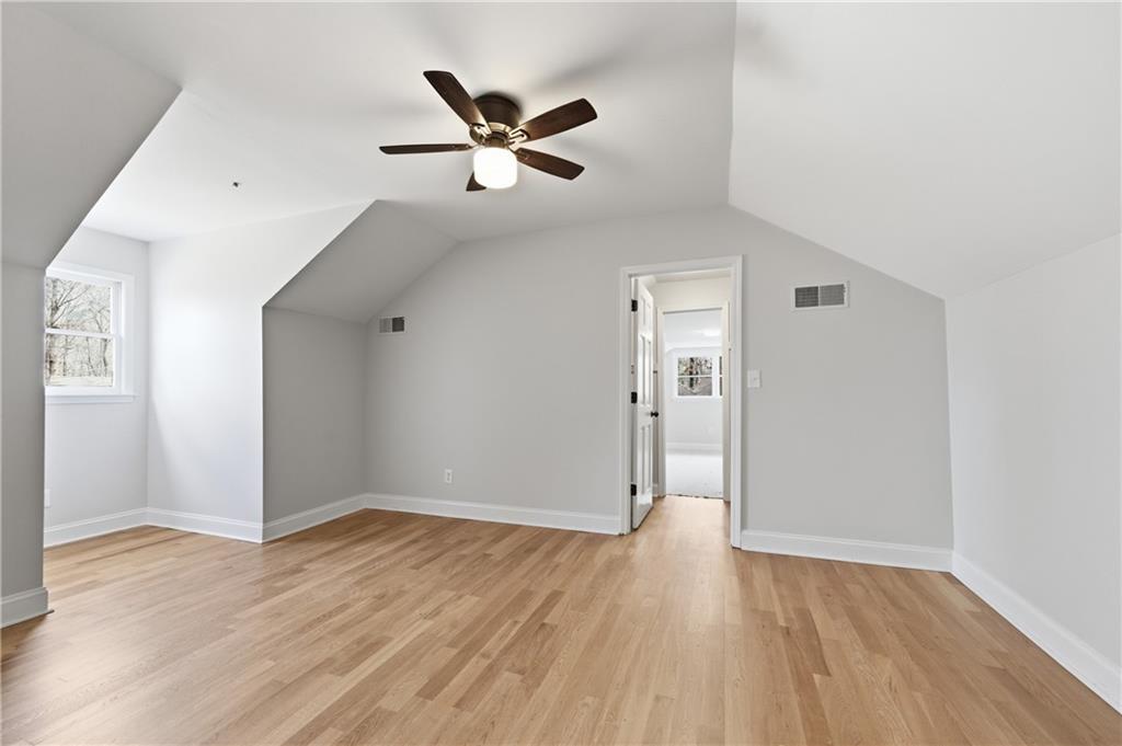 3571 Midvale Forest Court Tucker, GA 30084 - Photo 37 of 53 a view of a big room with wooden floor closet and windows