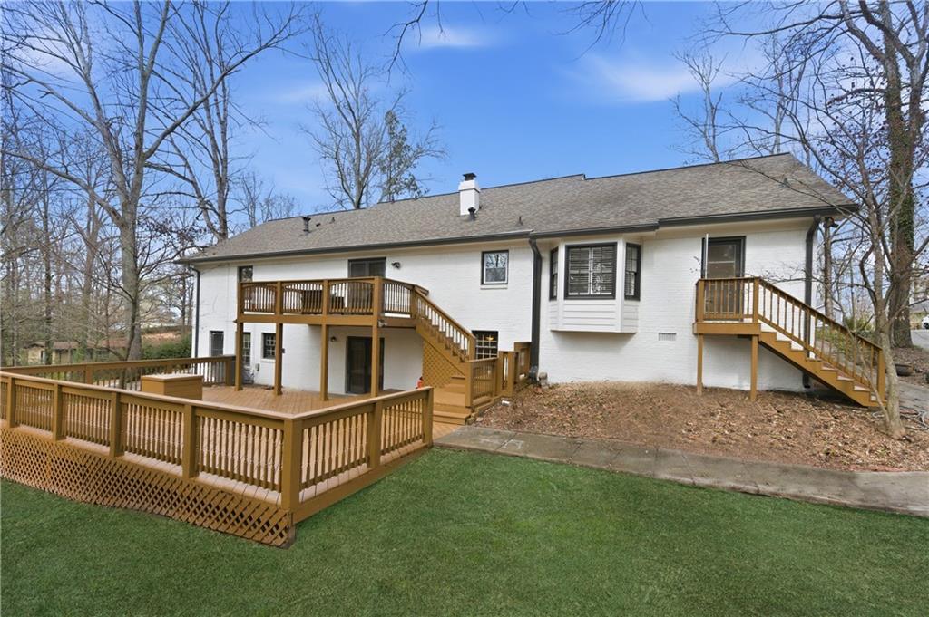 3571 Midvale Forest Court Tucker, GA 30084 - Photo 48 of 53 a view of a house with a yard and deck