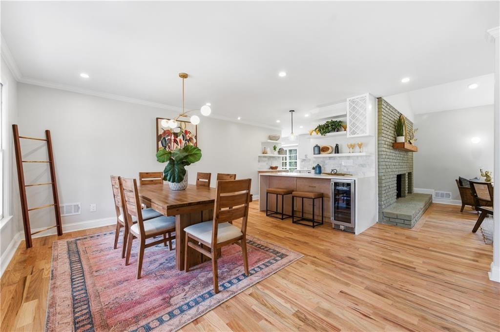 3571 Midvale Forest Court Tucker, GA 30084 - Photo 5 of 53 a dining room with furniture a chandelier and wooden floor