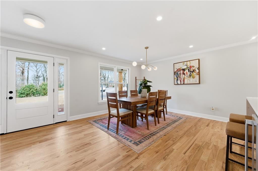 3571 Midvale Forest Court Tucker, GA 30084 - Photo 7 of 53 a view of a dining room with furniture and wooden floor