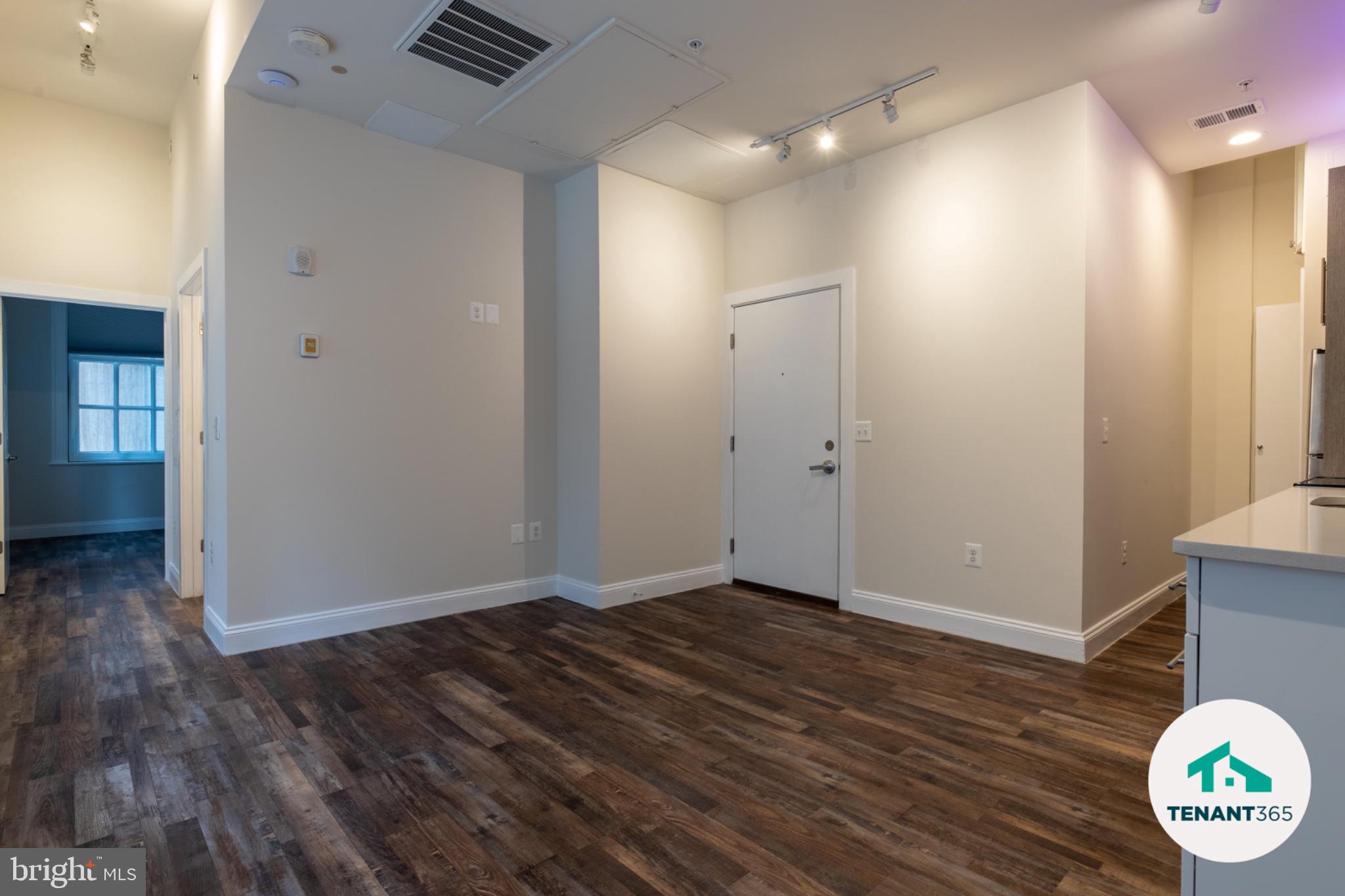 8 East Fayette Street, Unit 201 Baltimore, MD 21202 - Photo 2 of 14 Spacious entryway with modern finishes.