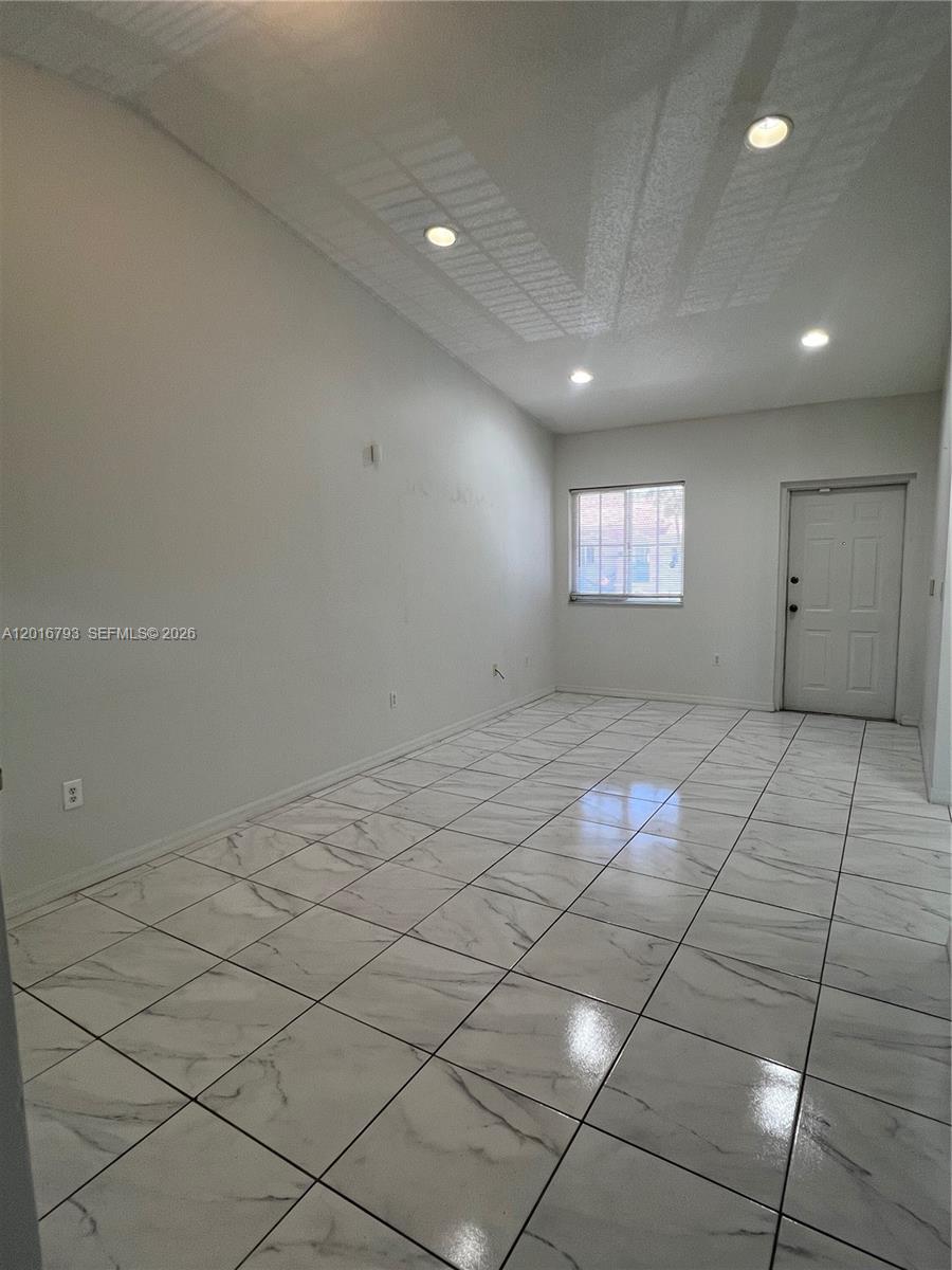 a view of an empty room and window