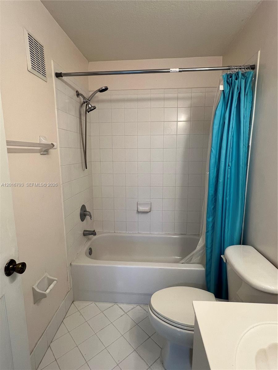 2931 Southeast 12th Road, Unit 20455 Homestead, FL 33035 - Photo 11 of 12 a bathroom with a toilet and a shower