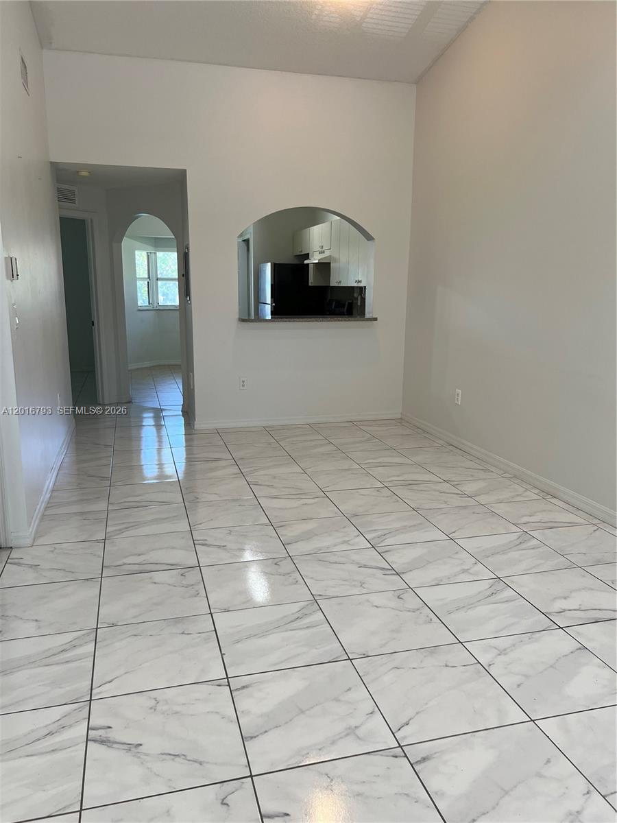 2931 Southeast 12th Road, Unit 20455 Homestead, FL 33035 - Photo 2 of 12 a view of a livingroom with wooden floor and a staircase