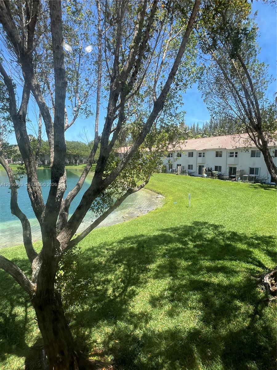 2931 Southeast 12th Road, Unit 20455 Homestead, FL 33035 - Photo 7 of 12 a view of an outdoor space and a yard