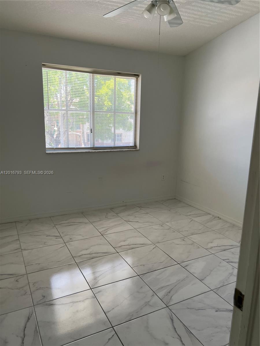 2931 Southeast 12th Road, Unit 20455 Homestead, FL 33035 - Photo 8 of 12 a view of an empty room with a window