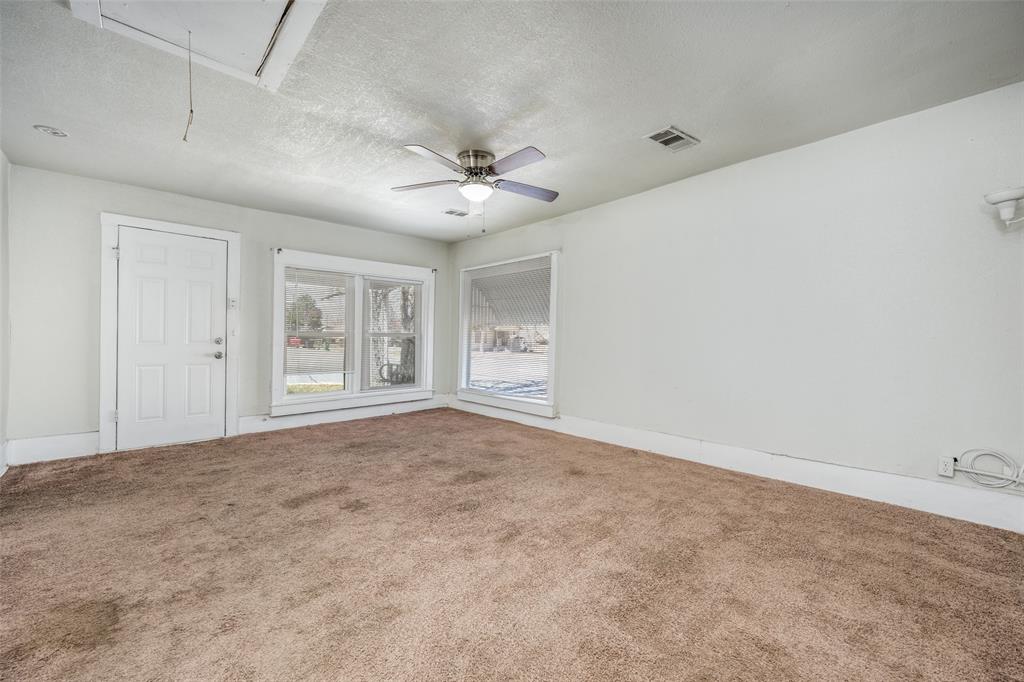 701 Lakey Street Denton, TX 76205 - Photo 6 of 25 a view of an empty room with a window