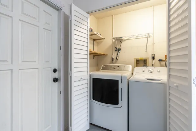 a view of storage and utility room with racks on the wall