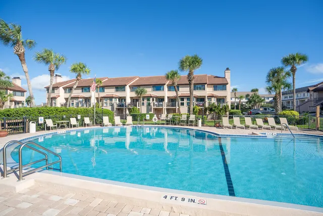 a view of swimming pool with outdoor seating