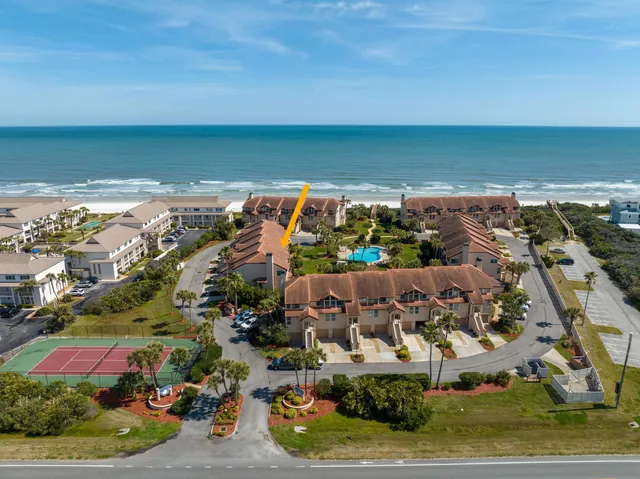 an aerial view of beach and ocean
