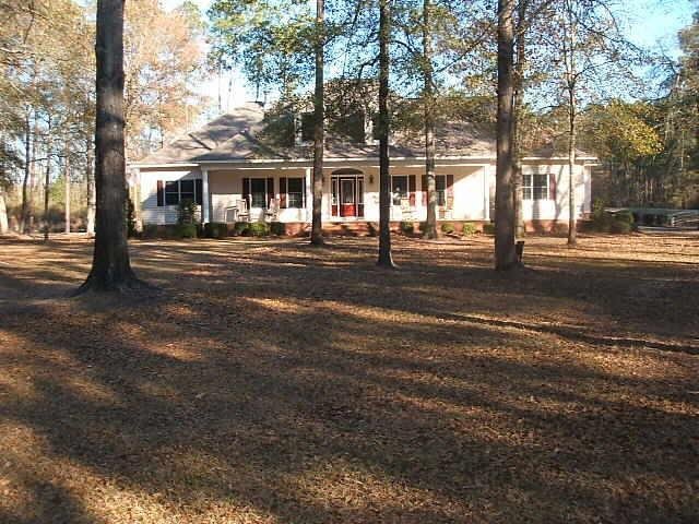 1375 Fred Beacham Road Rockledge, GA 30454 - Photo 1 of 1 a front view of a house with a garden