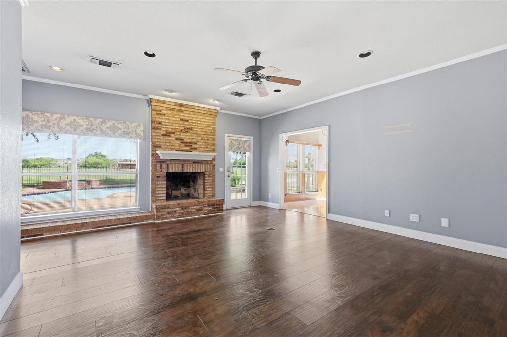 211 Bayne Road Haslet, TX 76052 - Photo 6 of 29 wooden floor in an empty room with a window