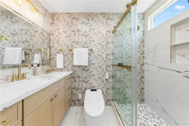 a bathroom with a sink a mirror and vanity