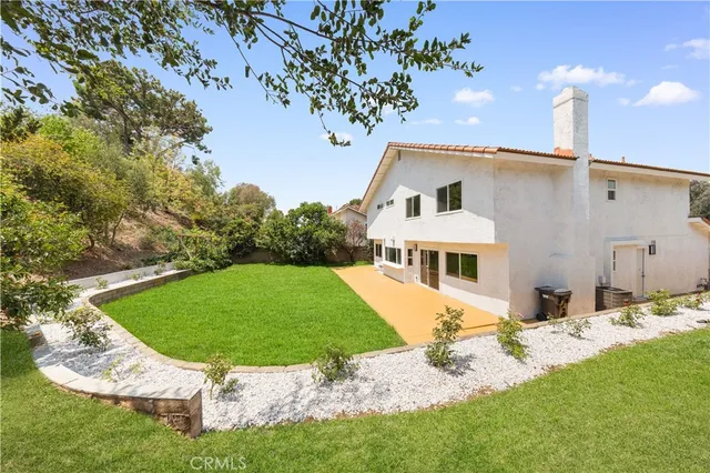 a front view of a house with yard