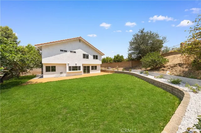 a house view with a garden space