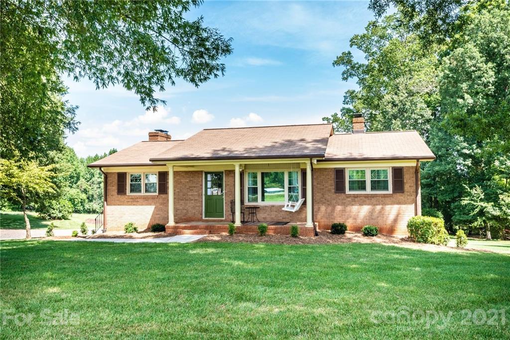 3064 Sandy Ford Road Newton, NC 28658 - Photo 3 of 41 a front view of house with yard and green space