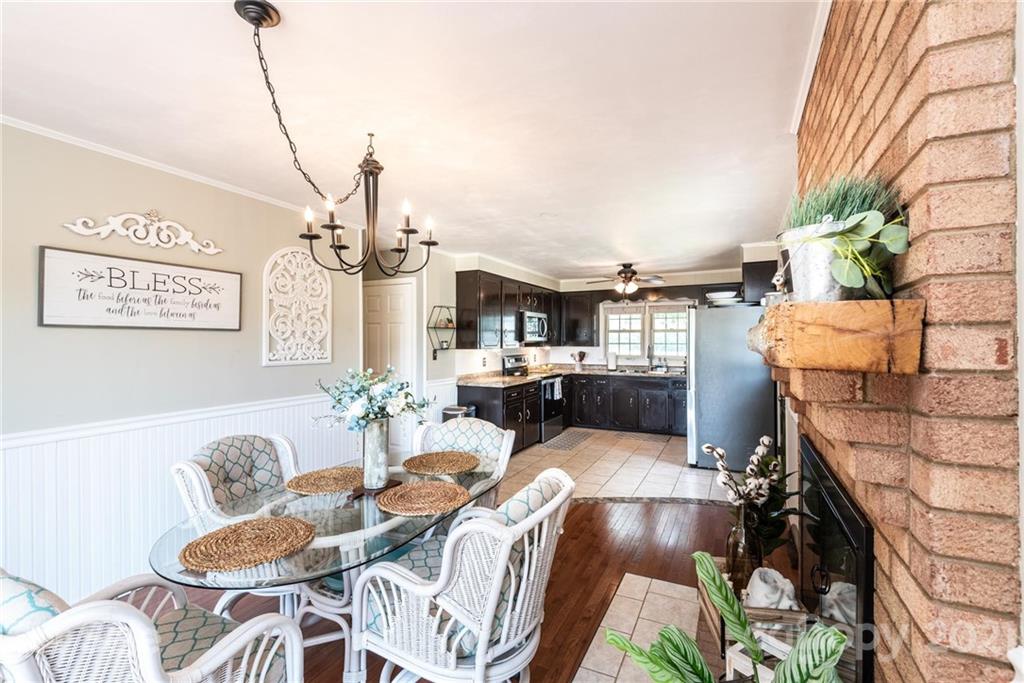 3064 Sandy Ford Road Newton, NC 28658 - Photo 22 of 41 a living room with furniture and a chandelier