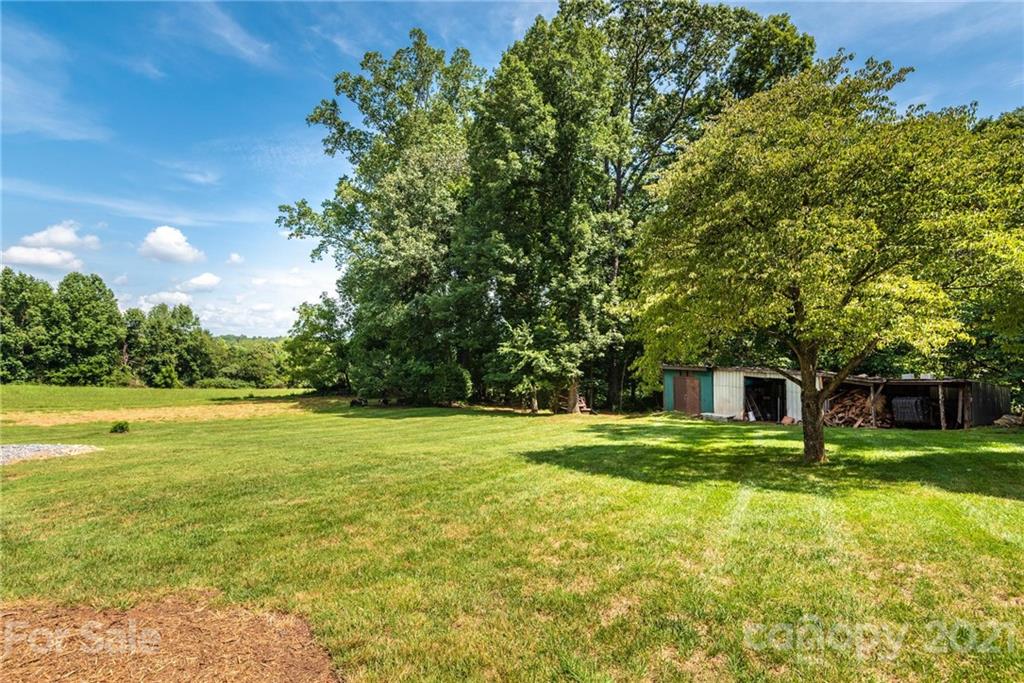 3064 Sandy Ford Road Newton, NC 28658 - Photo 8 of 41 a view of a big yard with a house
