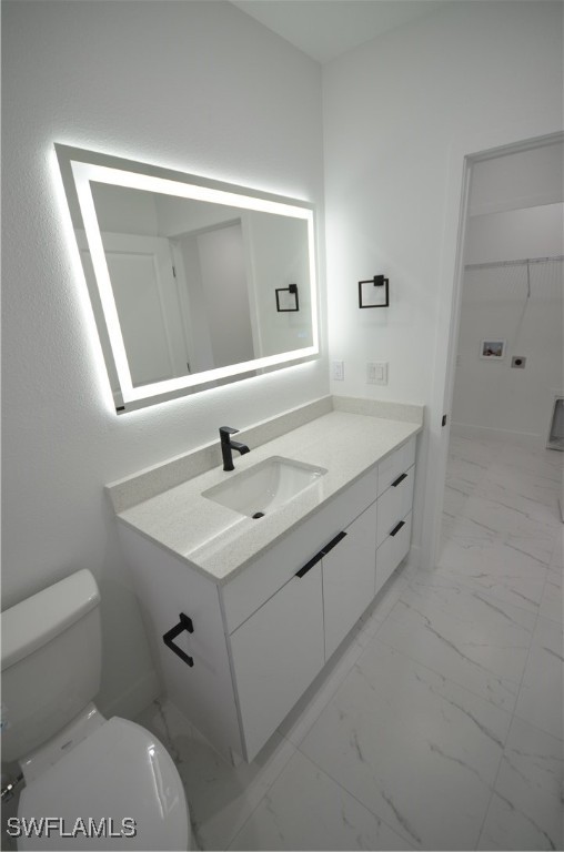 2132 Barker Boulevard Fort Myers, FL 33916 - Photo 11 of 36 a bathroom with a sink toilet and mirror