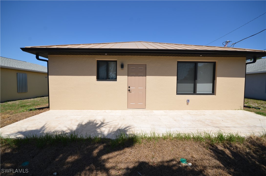 2132 Barker Boulevard Fort Myers, FL 33916 - Photo 30 of 36 a house with yard in front of it
