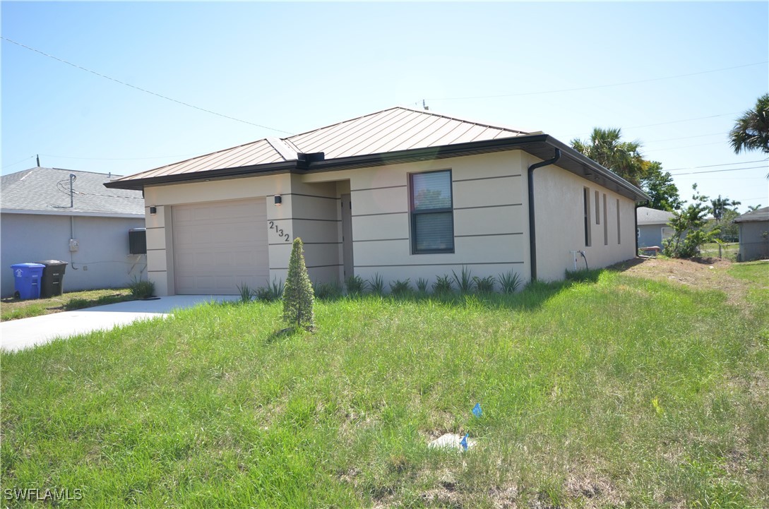 2132 Barker Boulevard Fort Myers, FL 33916 - Photo 35 of 36 a backyard of a house with lots of green space