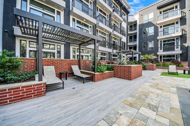 a bathroom with a double vanity sink a mirror and a shower