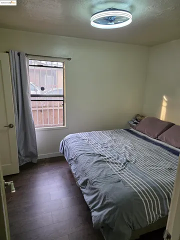 a bathroom with a toilet and a shower curtain