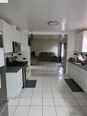 a bathroom with a toilet sink vanity and mirror