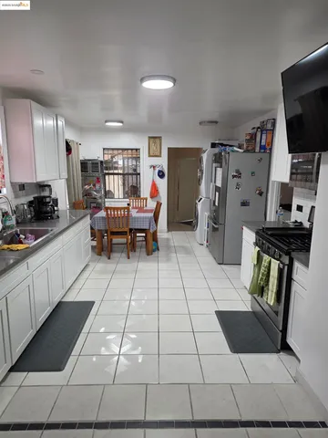 a living room with furniture and flowers