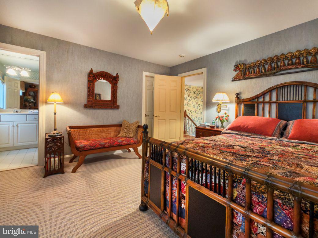 12 Chalous Lane Villanova, PA 19085 - Photo 30 of 39 a bedroom with furniture and a book shelf