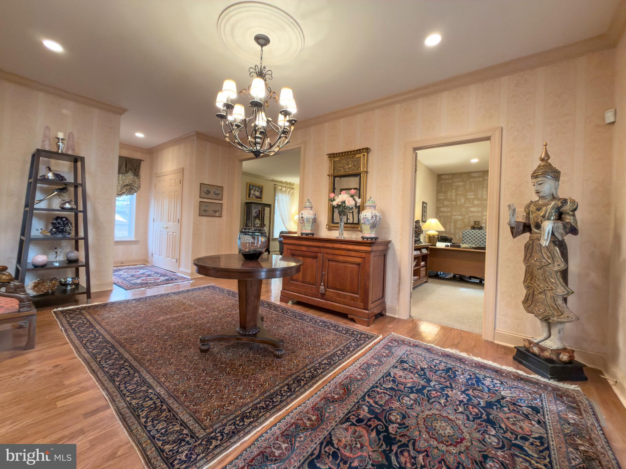 12 Chalous Lane Villanova, PA 19085 - Photo 5 of 39 a living room with fireplace furniture and a rug