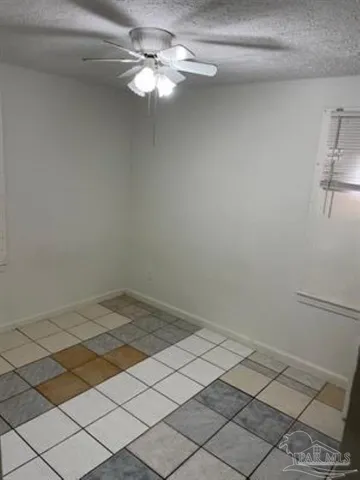 a view of a room with a projector and a fan