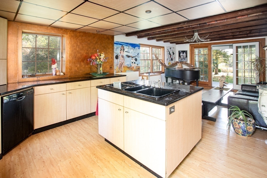 17 Quail Trail Westport, MA 02790 - Photo 11 of 40 a kitchen that has a sink and a stove