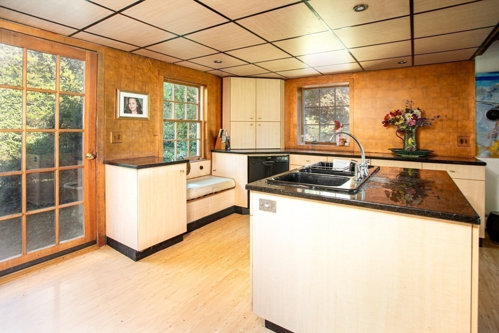 17 Quail Trail Westport, MA 02790 - Photo 12 of 40 a kitchen with a stove a refrigerator and wooden floor