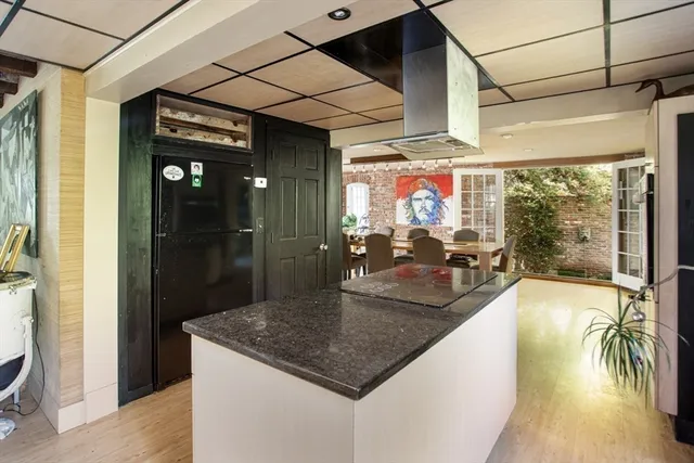 a kitchen with sink and cabinets