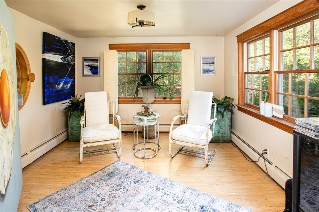 17 Quail Trail Westport, MA 02790 - Photo 20 of 40 a living room with fireplace furniture and a flat screen tv
