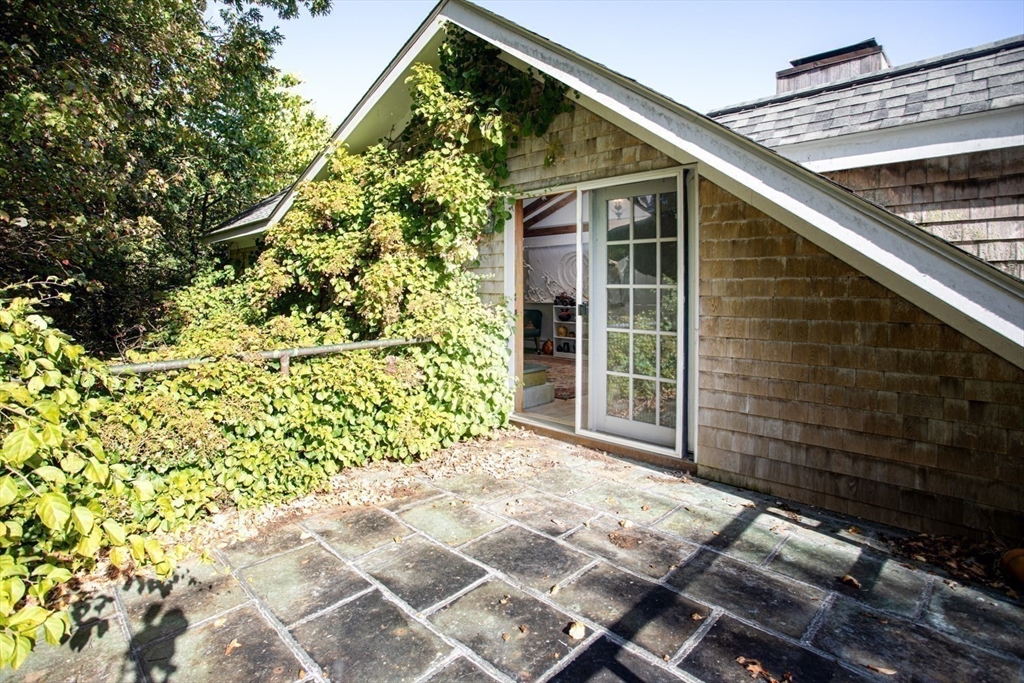 17 Quail Trail Westport, MA 02790 - Photo 27 of 40 a front view of a house with garden