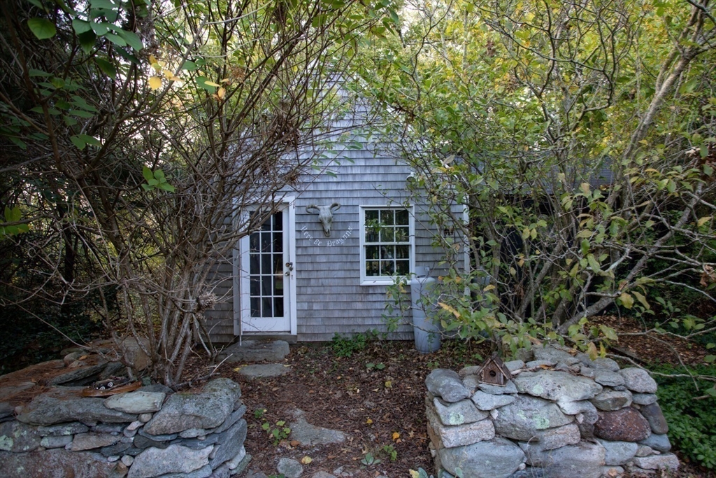 17 Quail Trail Westport, MA 02790 - Photo 29 of 40 a front view of a house with garden